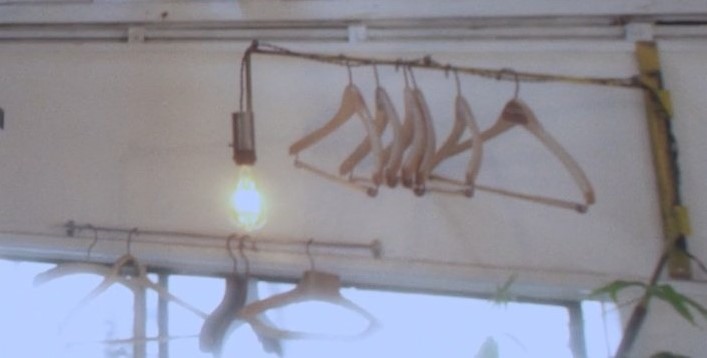 Multiple empty clothes hangers on a rack.